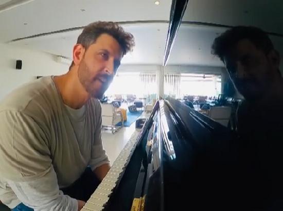 Hrithik Roshan tries hand at piano in special video photobombed by Sussane Khan