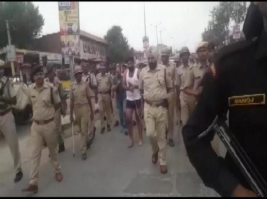 Rajasthan: Police parade, in underwear, 13 men accused of helping gangster flee lock-up