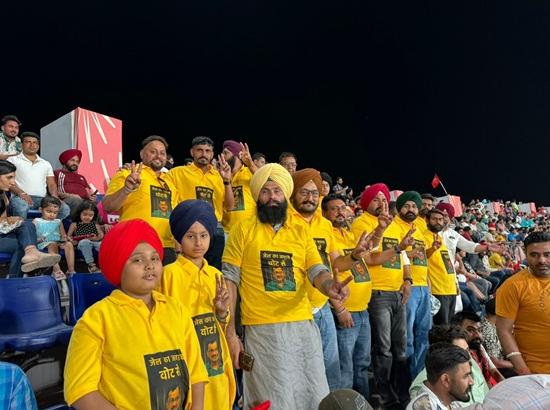 AAP supporters wear T-shirts with Arvi