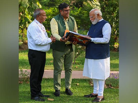 PM Modi receives Panchjanya's book 