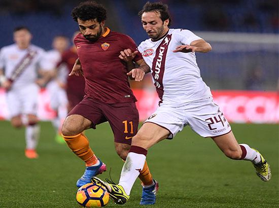 Roma's Mohammed Salah  vies with Torino's Emiliano Moretti 