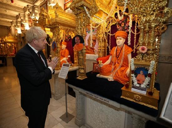 British PM visits Hindu temple, pledges support to Modi's new India mission