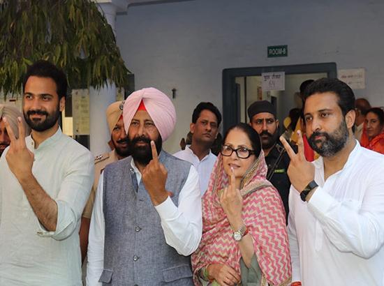 Congress candidate Kewal Singh Dhillon with family after casting vote in Barnala