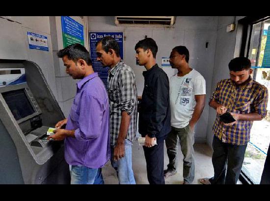 Short queues outside ATMs, but many machines still dry