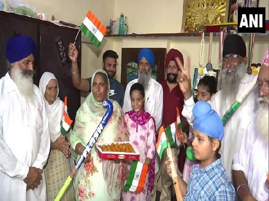 Women's hockey team defender Gurjit Kaur's family exchanges sweets in Amritsar post India's win