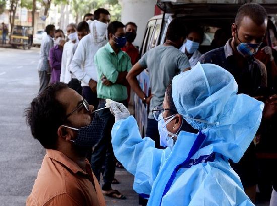 India reports highest-ever one day spike with 2,17,353 new COVID-19 cases, 1,185 deaths