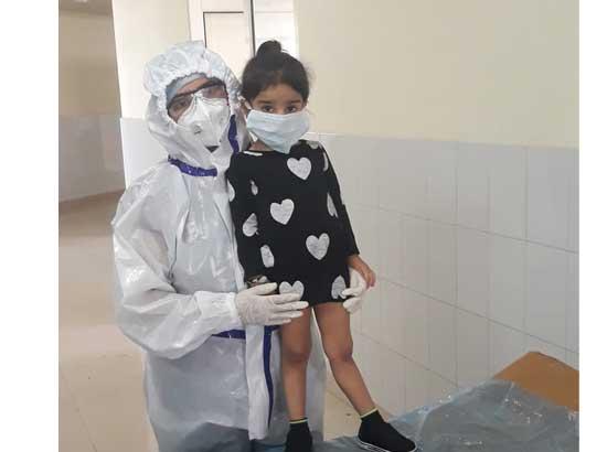 Brave Heart Mother tending her Corona Positive 2 years daughter 24X7 donning complete PPE kit