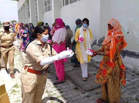 District police in association with NGOs distributed sanitary napkins, soaps & masks in slum areas