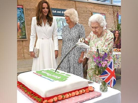 Queen Elizabeth steals the Eden Project's show by cutting cake with sword