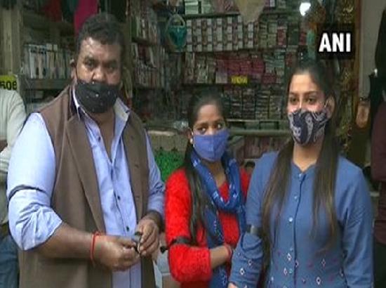 Shopkeepers in Delhi market tie black ribbons to support farmers' Bharat Bandh