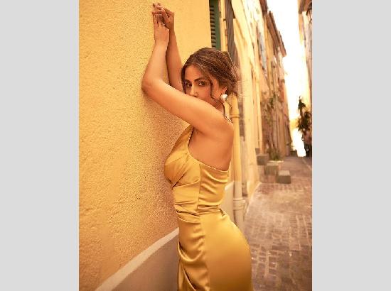 Stunner Hina Khan slays in satin golden gown at Cannes