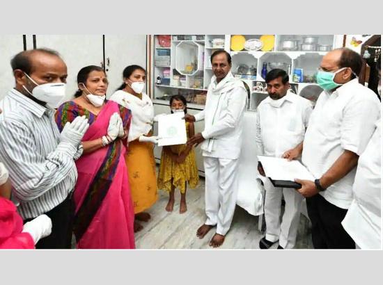 Telangana CM hands over Rs 5 cr cheque, plot and Group I Govt Job order to Col Santosh’s