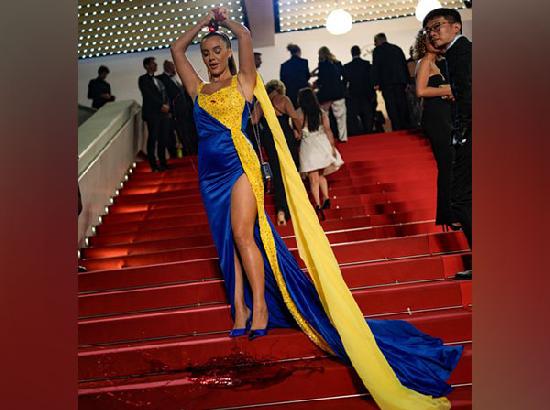 Woman draped in 'Ukrainian colours' pours fake blood on herself at Cannes red carpet; Watc